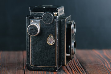 The old Medium format TLR camera on a cement background.