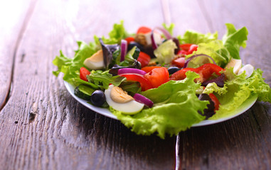 Fresh vegetables on wooden and blur background