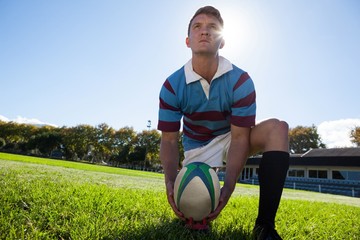 Low angle view of player getting ready to kick for goal