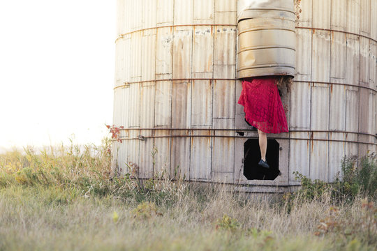 A curious girl takes an adventure up an abandoned silo 