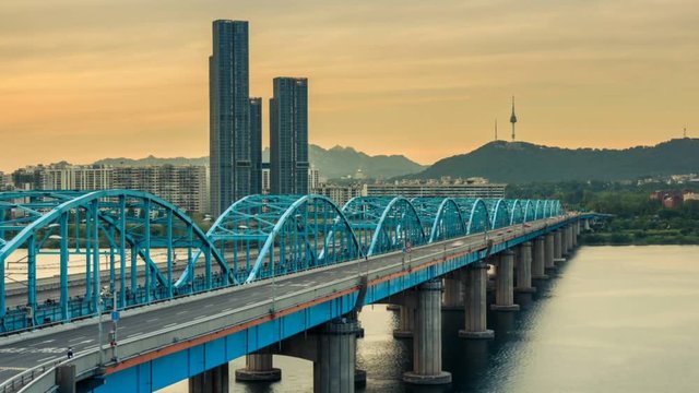 Time lapse of Seoul City skyline from day to night at Dongjak Bridge and Han river in Seoul, South Korea