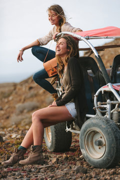 Female Friends in Adventure in the Desert With Buggy