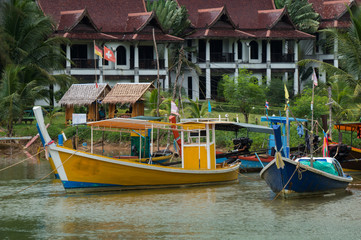 Fototapeta na wymiar Fishing boats in a small river estuary