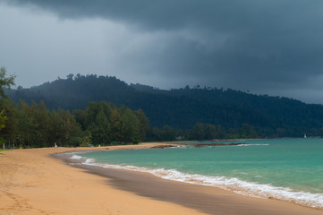 Storm clouds gathering over the jungle and beach of Khao Lak