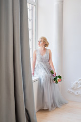 Fototapeta premium Fashion bride in gray dress with make-up smoky eyes