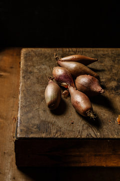 Shallots on chopping board