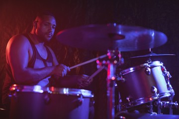 Fototapeta na wymiar Male drummer performing at music concert