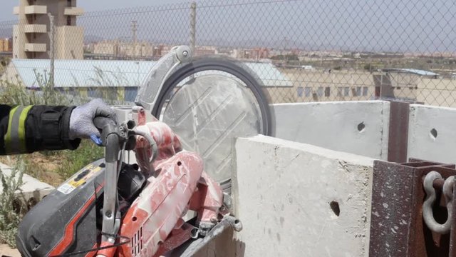 Firefighter practicing with a disc cutter