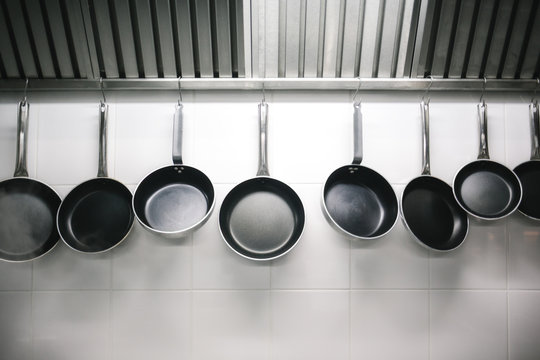 Frying Pans Hanging in a Kitchen