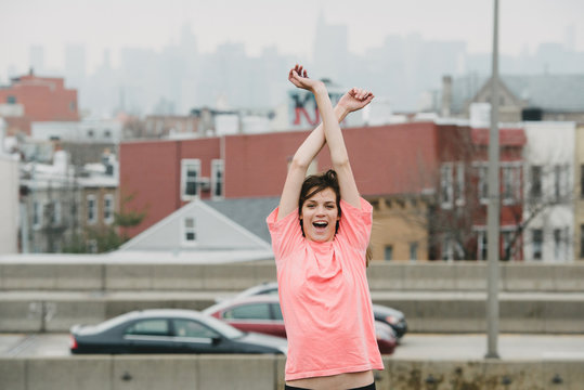 Happy free-spirited girl laughing at camera