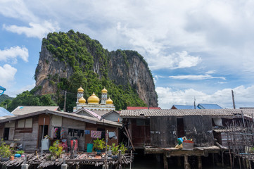 The fishing village of Koh Panyee and dramatic karst rising behind it