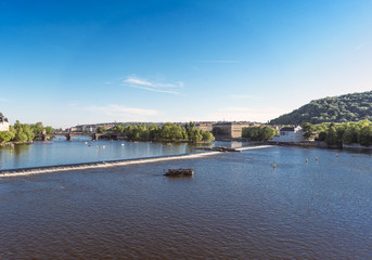 Fototapeta na wymiar View of the Vltava river with the Legii bridge in the background from the Charles Bridge, Prague.