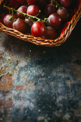 Border and frame - top view of grapes over black background