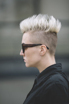 blond woman with mohawk and sunglasses