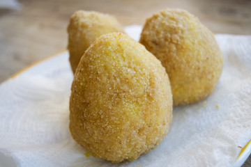 sicilian arancine fried in boiling oil