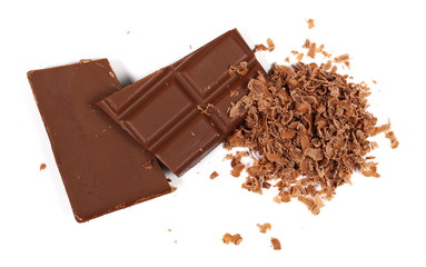 Chopped and chocolate pieces isolated on white background
