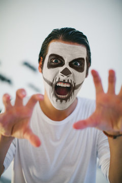 Portrait of man with Halloween skull make-up