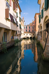 Fototapeta na wymiar Treviso / View of the historical architecture and river channel.