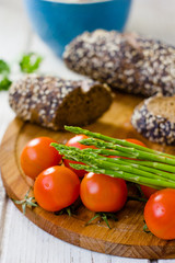 Fresh asparagus, bread and tomatoes