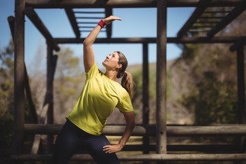 Woman exercising during obstacle course