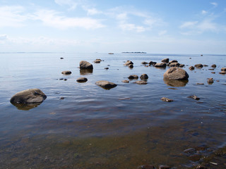 Seascape water with brown rocks 