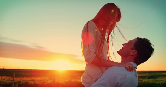 Romantic couple having fun in field