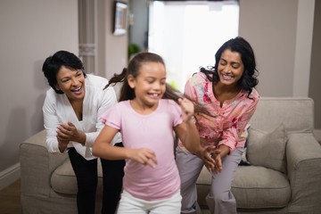 Obraz premium Happy multi-generation family dancing together