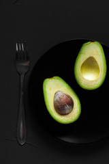avocado halves on a plate