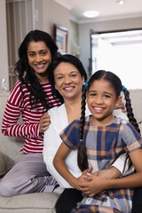 Fototapeta premium Portrait of smiling multi-generation family in row