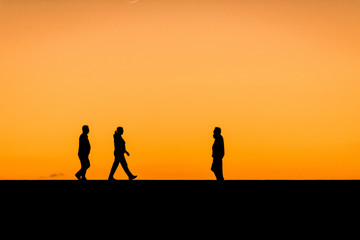 Tourists waiting for the sundown. Near the Maspalomas Lighthouse in the south of Gran Canaria