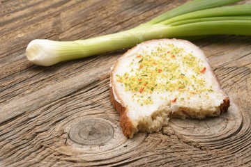 Lard spread on home baked bread with paprika and vegeta powder