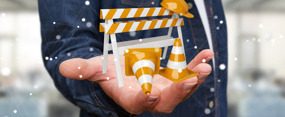 Businessman using digital 3D rendering under construction signs