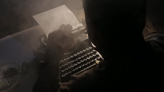 The writer smokes and writes