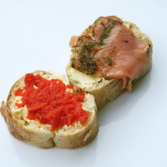 White bread stuffed with butter and smoked salmon isolated healthy food