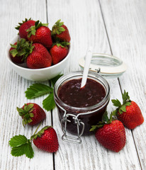 Strawberry jam and fresh strawberries
