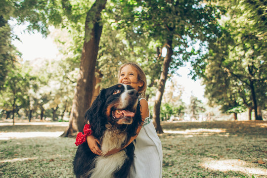 Small Blonde Girl With Huge Dog