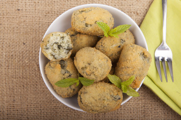 a handful of homemade croquettes of spinach