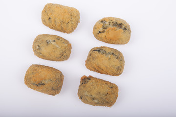a handful of homemade croquettes of spinach isolated on white