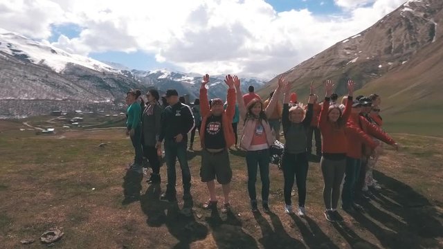 the group of travelers in the mountains are in the circle