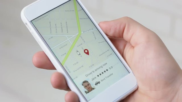 Taxi driver arrives on smartphone application interface