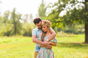 Fototapeta premium Young couple in love hug each other in nature