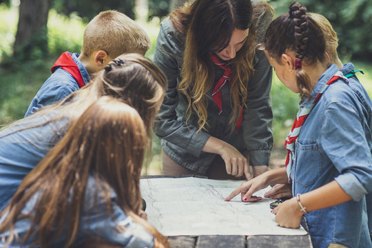 Childern Scouts Learning Orinetation Using A Map