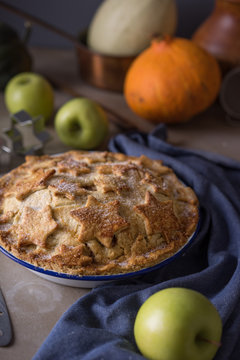 Homemade apple pie cooling on a table