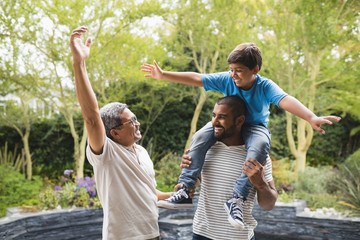 Obraz premium Smiling of happy multi-generation family enjoying at park