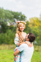 Fototapeta premium happy young couple hugging on nature