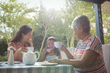 Happy family having tea