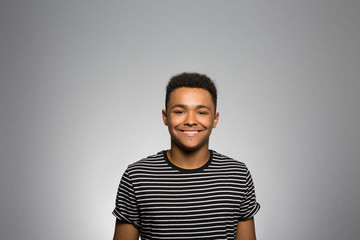 studio portrait of an excited young man 