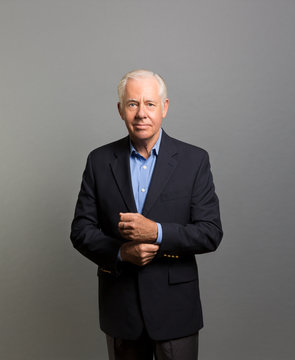 Studio Portrait Of A Businessman Pondering