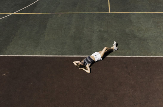 Girl Relax On The School Sport Field