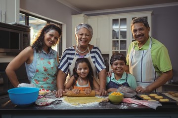Happy family preparing dessert in kitchen